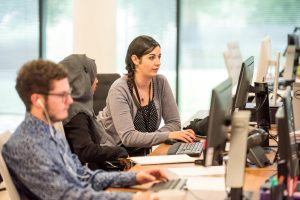 Workers using computers in an office